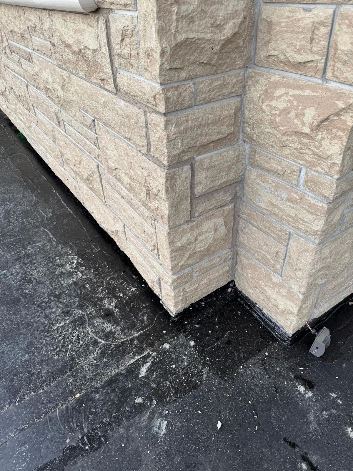 Parkade deck showing a newly applied slip-resistant polyurethane traffic coating with parking stall lines.