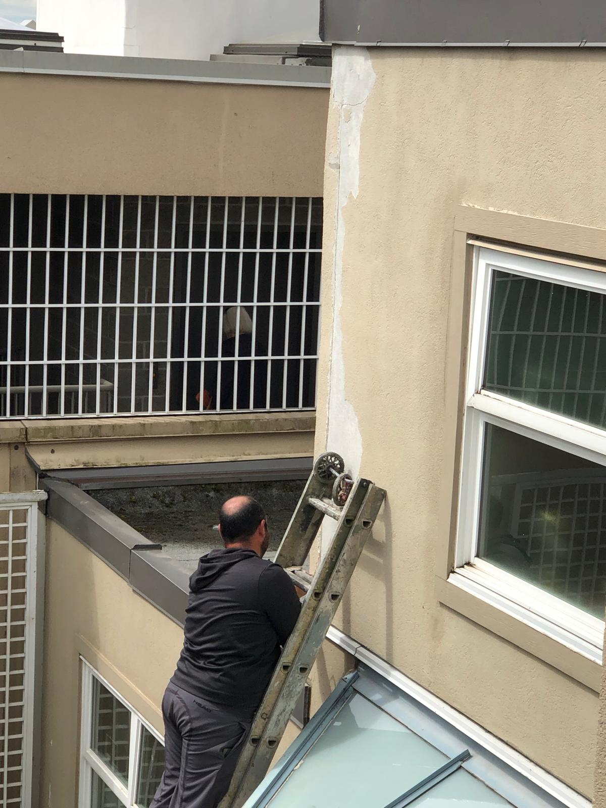 Downtown Vancouver high-rise glass condos receiving professional window washing and envelope care.